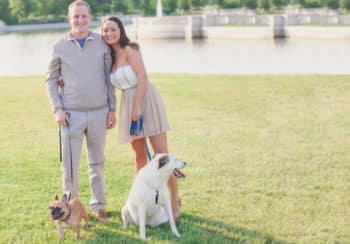 image of michelle, partner, and two dogs in park