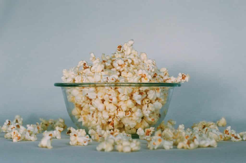 Picture of puff popcorn in a clear glass bowl.