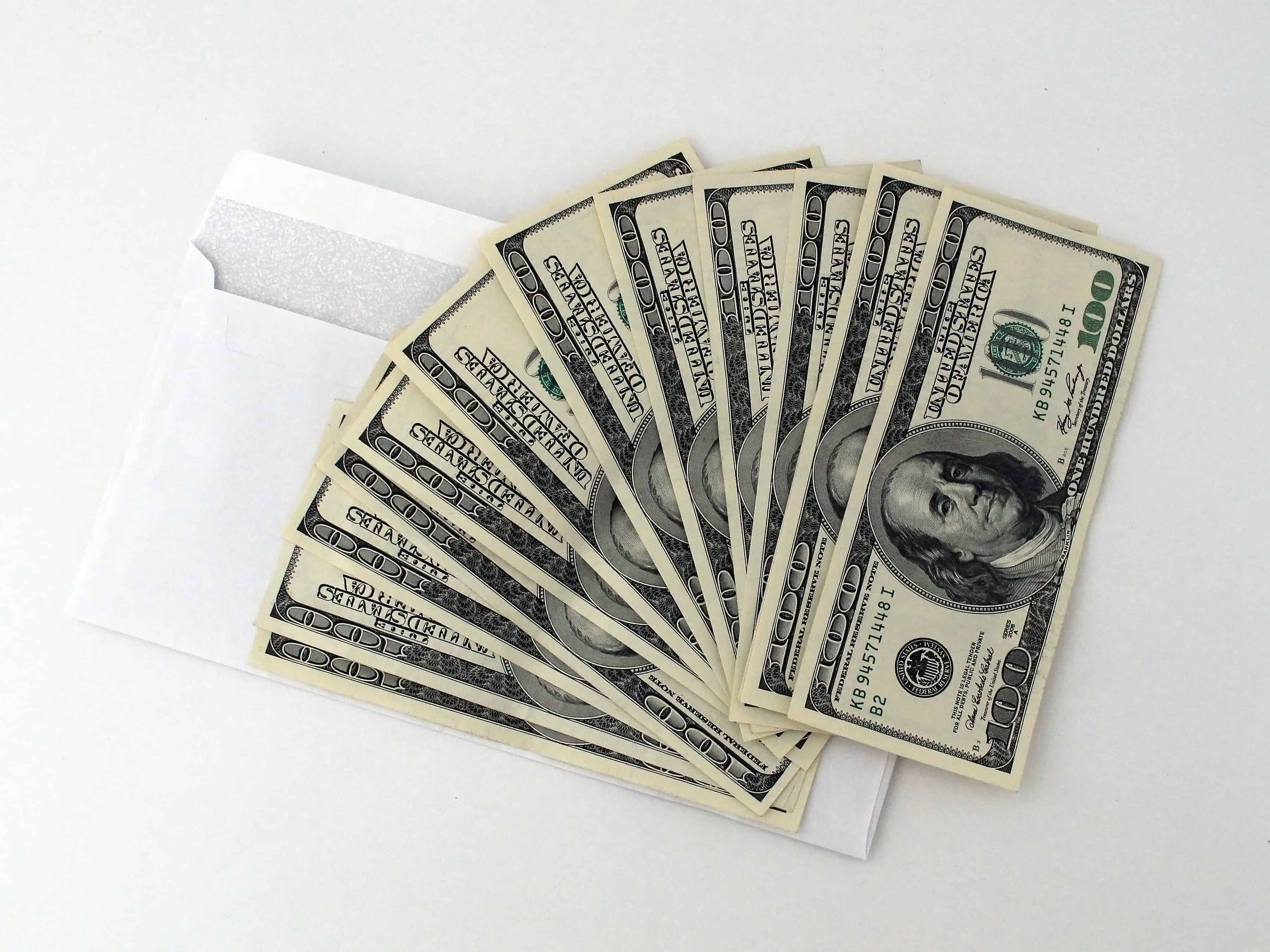 easy passive income ideas. Image of $100 dollar bills.