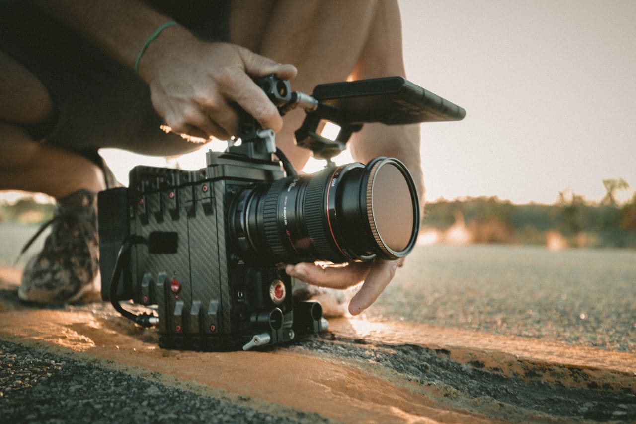 hobbies that make money - filming - person filming with a professional camera on set