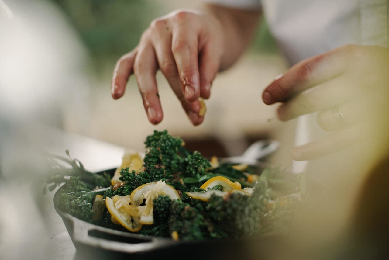 hobbies that make money - cooking - person making a salad.