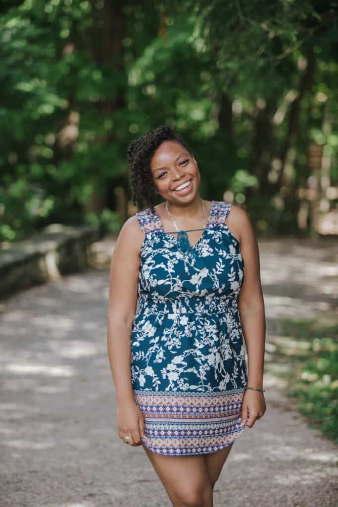 Danielle Desir walking on a shaded path