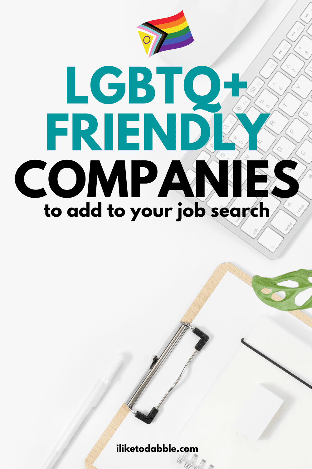 keyboard and clipboard on a white desk with title text overlay that reads: lgbtq+ friendly companies